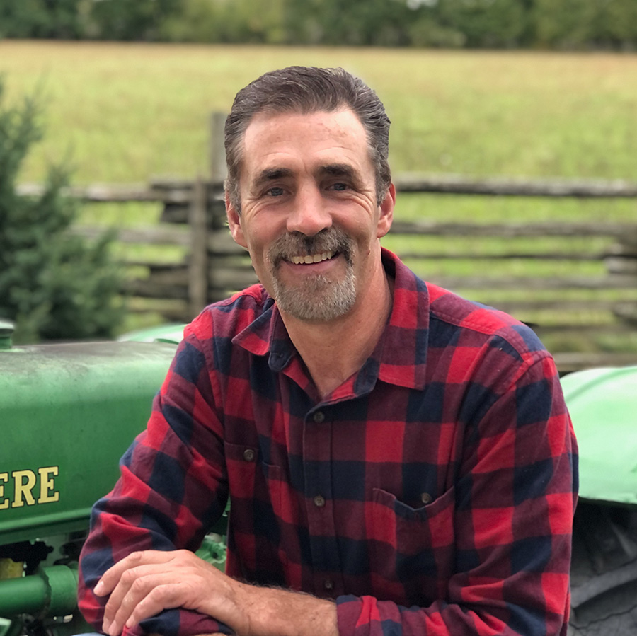 Portrait of Paul in front of old JD